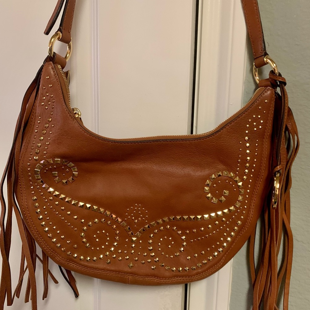Genuine Michael Kors leather shoulder bag.